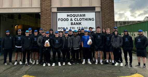 PHOTO COURTESY OF GRAYS HARBOR COLLEGE The Grays Harbor College baseball team poses for a photo after donating turkeys to the Hoquiam Food & Clothing Bank.