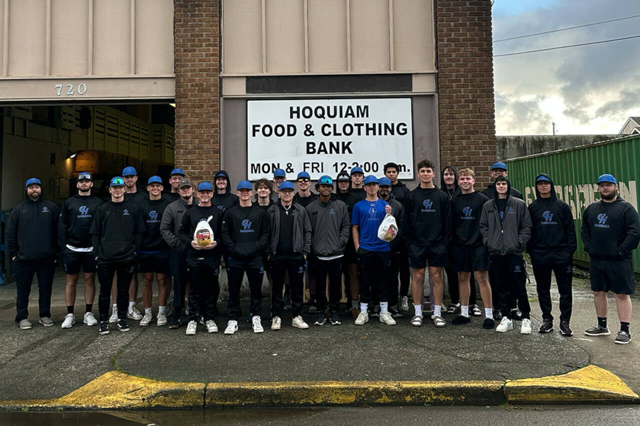 PHOTO COURTESY OF GRAYS HARBOR COLLEGE The Grays Harbor College baseball team poses for a photo after donating turkeys to the Hoquiam Food & Clothing Bank.