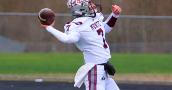 DAILY WORLD FILE PHOTO 
Montesano junior quarterback Tyson Perry throws downfield during a win over La Center on Nov. 23. The Bulldogs will face Seton Catholic in a 1A State semifinal matchup on Saturday in Vancouver.