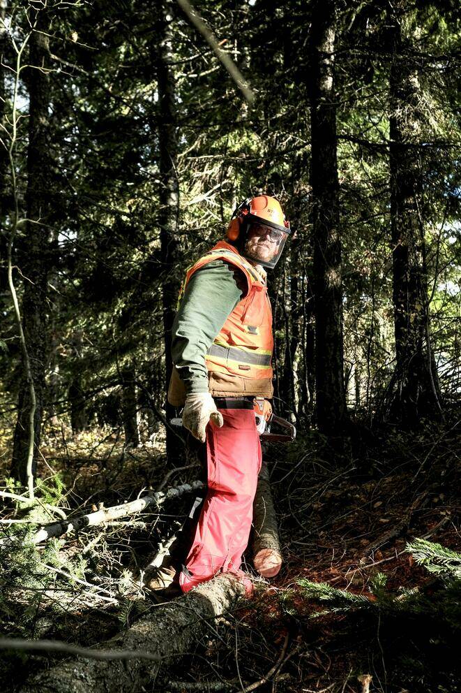 Rake Force founder and owner Jake Dailey pauses while thinning a stand of young conifers on Nature Conservancy land above Cle Elum in late October.