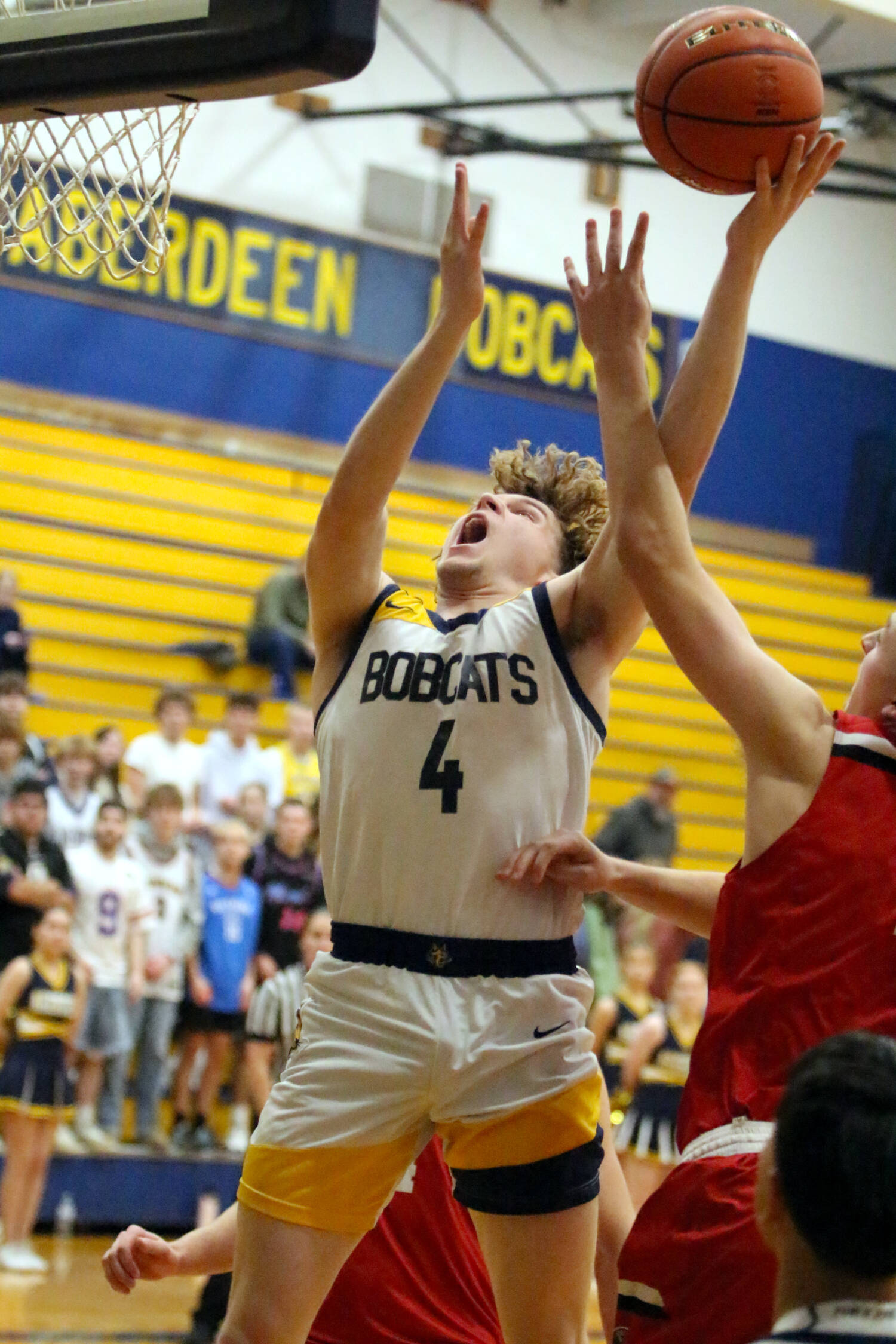 RYAN SPARKS | THE DAILY WORLD Aberdeen senior Tarren Lewis (4) drives to the hoop during an 85-50 season-opening loss to R.A. Long on Tuesday at Aberdeen High School.