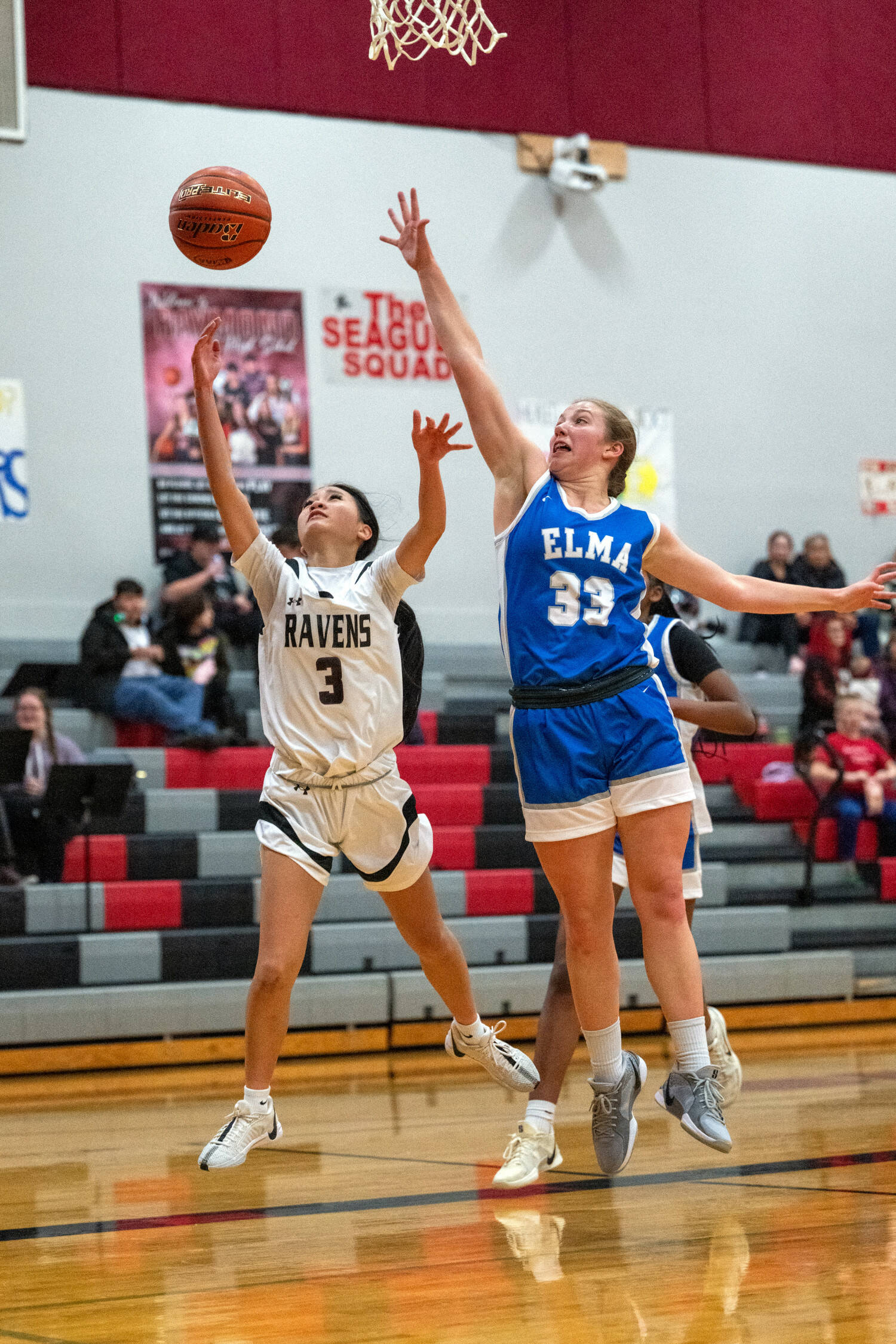 PHOTO BY FOREST WORGUM Raymond-South Bend guard Megan Kongbouakhay (3) drives to the hoop against Elma’s Olivia Moore during the Ravens’ 56-27 win on Thursday in Raymond.