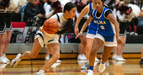 PHOTO BY FOREST WORGUM Raymond-South Bend’s Megan Kongbouakhay (left) dribbles against Elma’s Nency Guzman in the Ravens’ 56-27 win on Thursday in Raymond.