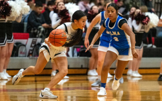 PHOTO BY FOREST WORGUM Raymond-South Bend’s Megan Kongbouakhay (left) dribbles against Elma’s Nency Guzman in the Ravens’ 56-27 win on Thursday in Raymond.