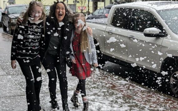 Wil Russoul
A trio enjoys a hint of snow at WinterFest on Saturday.