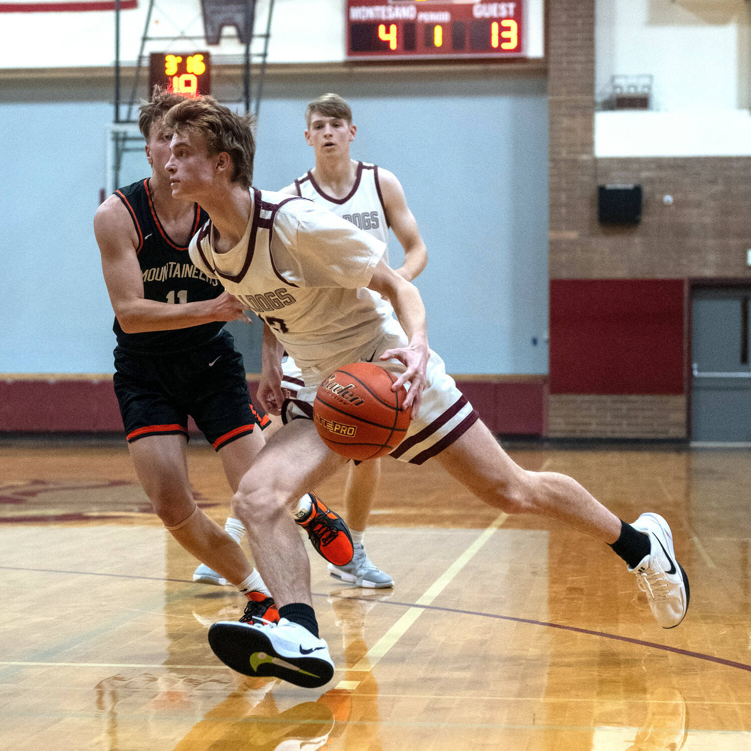 PHOTO BY FOREST WORGUM Montesano senior Caleb Bruland (right) drives the lane during a 51-27 loss to Rainier on Monday in Montesano.