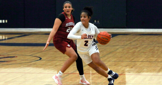 DYLAN WILHELM | THE CHRONICLE 
Black Hills’ Natalie Buchanan (2) drives around Hoquiam’s Aaliyah Kennedy during the Grizzlies’ 70-59 overtime loss on Tuesday at Black Hills High School.
DYLAN WILHELM | THE CHRONICLE Black Hills’ Natalie Buchanan (2) drives around Hoquiam’s Aaliyah Kennedy during the Grizzlies’ 70-59 overtime loss on Tuesday at Black Hills High School.