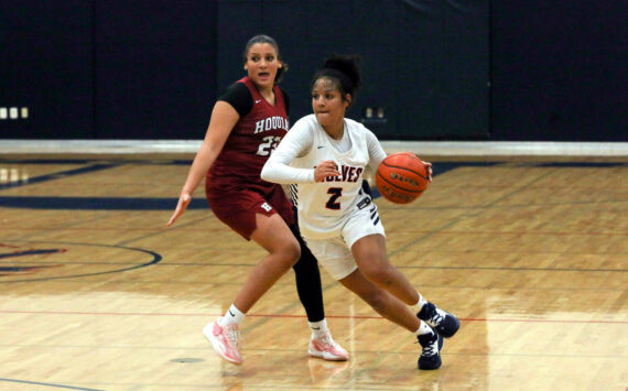 DYLAN WILHELM | THE CHRONICLE Black Hills’ Natalie Buchanan (2) drives around Hoquiam’s Aaliyah Kennedy during the Grizzlies’ 70-59 overtime loss on Tuesday at Black Hills High School.