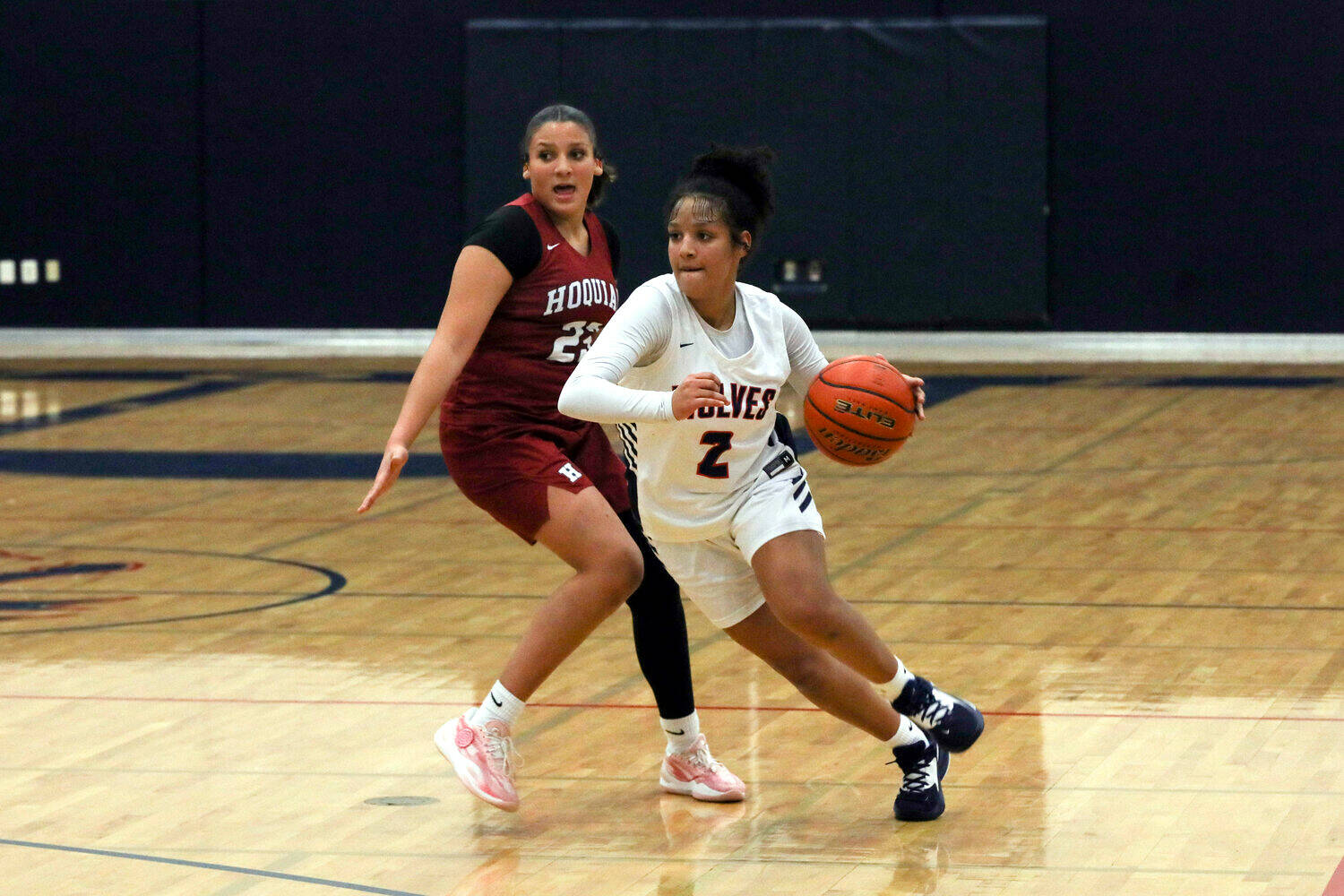 DYLAN WILHELM | THE CHRONICLE Black Hills’ Natalie Buchanan (2) drives around Hoquiam’s Aaliyah Kennedy during the Grizzlies’ 70-59 overtime loss on Tuesday at Black Hills High School.