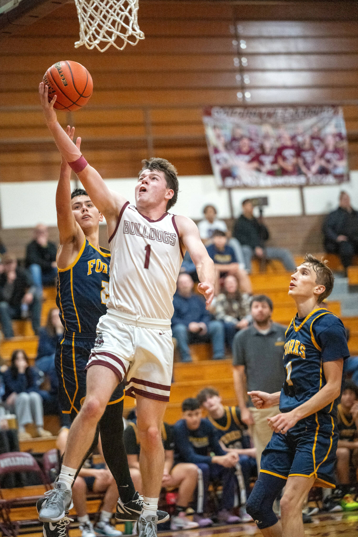 PHOTO BY FOREST WORGUM Montesano’s Colton Grubb (1) drives to the hoop during a 58-51 loss to Forks on Friday at Montesano High School.