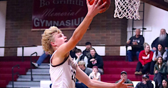 PHOTO BY HAILEY BLANCAS Montesano’s Mason Fry drives to the hoop during the Bulldogs’ 58-51 loss to Forks on Friday in Montesano.