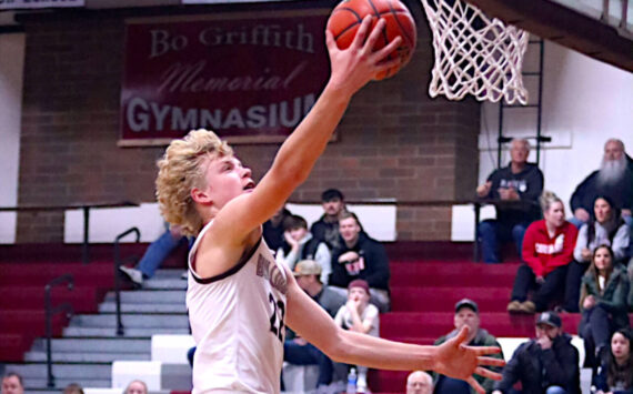 PHOTO BY HAILEY BLANCAS Montesano’s Mason Fry drives to the hoop during the Bulldogs’ 58-51 loss to Forks on Friday in Montesano.