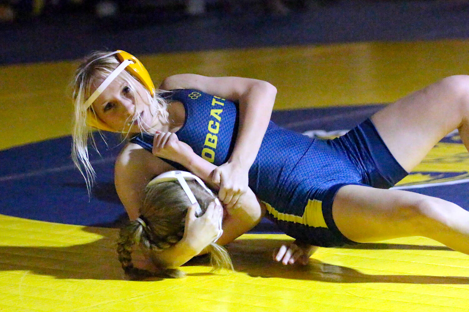 RYAN SPARKS | THE DAILY WORLD
Aberdeen sophomore Daisy Vessey (top) controls Montesano's Karlee Watson during the title match of the 110-pound weight class at the Grays Harbor Championships on Saturday at Aberdeen High School.