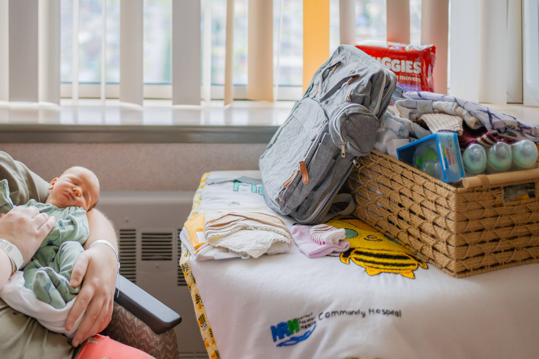 Baby Oliver is pictured alongside a gift basket put together by Harbor Regional Health.