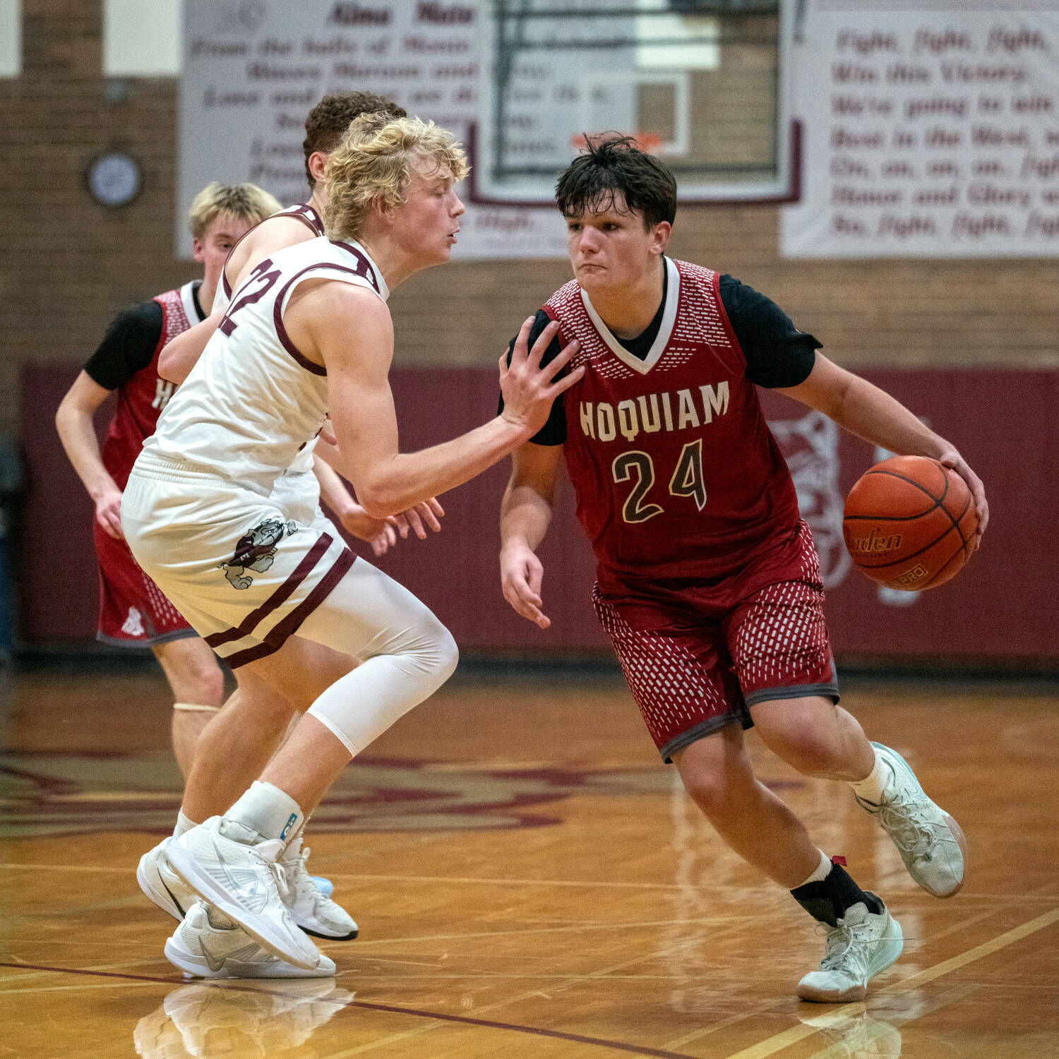 PHOTO BY FOREST WORGUM Hoquiam guard Lincoln Niemi (24) is defended by Montesano forward Mason Fry during the Bulldogs’ 54-45 victory on Wednesday at Montesano High School.