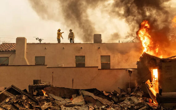 Jason Armond / Los Angeles Times / TNS
Firefighters fight the Eaton fire in Altadena on Wednesday, Jan. 8.