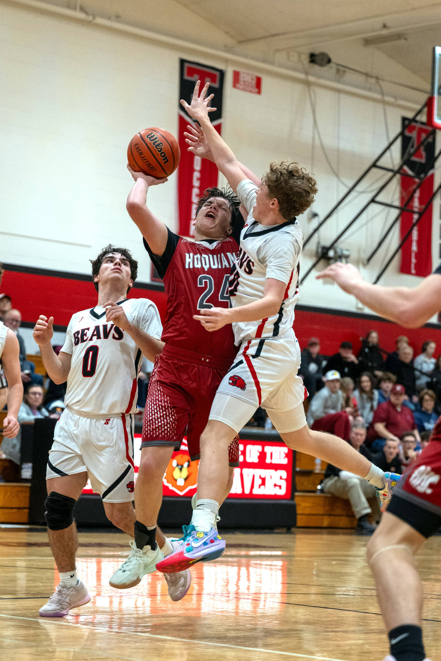 PHOTO BY FOREST WORGUM Hoquiam’s Lincoln Niemi (24) collides with Tenino’s Jaxson Gore during the Grizzlies’ 57-41 loss on Friday at Tenino High School.