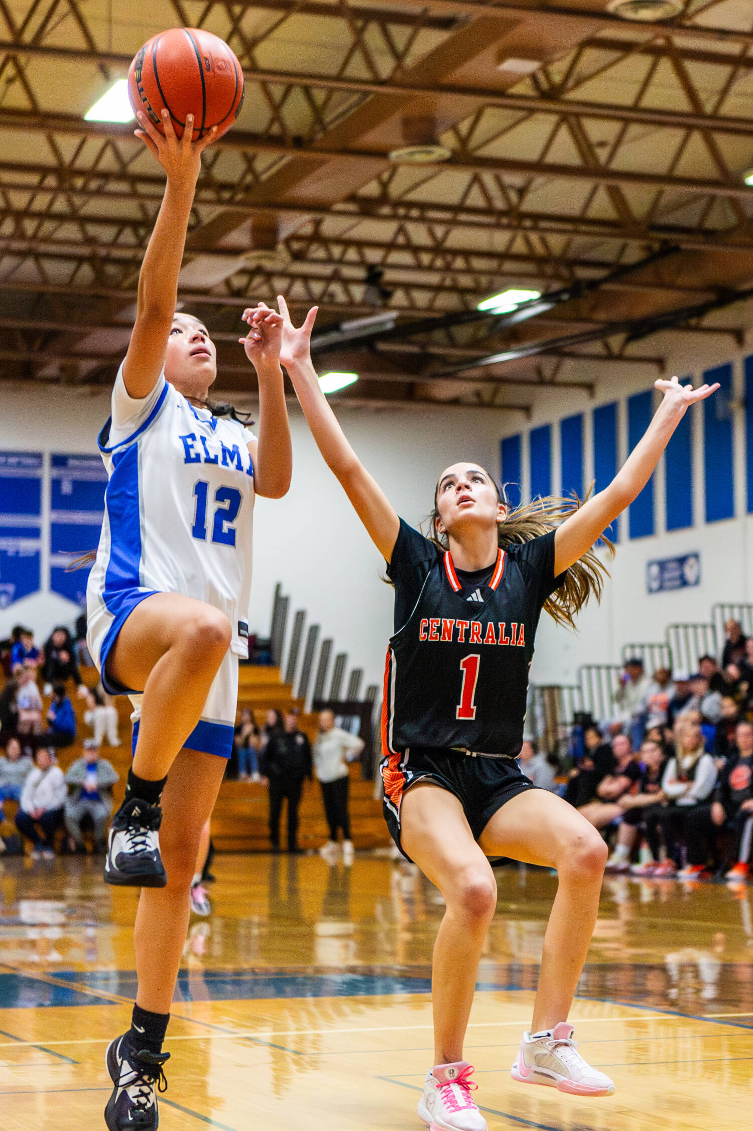 PHOTO BY MIKE ROBERTS Elma’s Kahlea Tolentino (12) puts up a shot against Centralia’s Ayana Saucedo during the Eagles’ 46-26 loss on Friday in Elma.