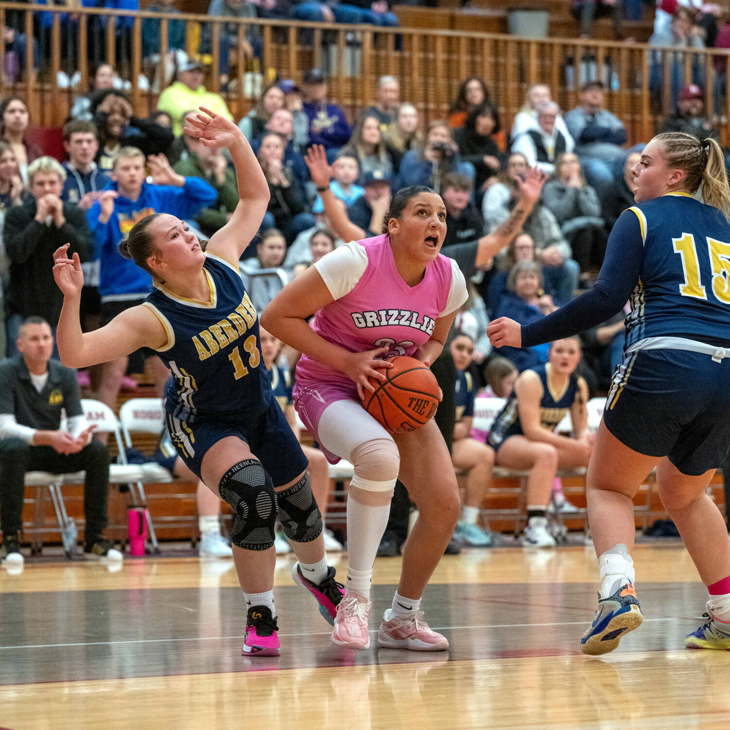 PHOTO BY FOREST WORGUM Hoquiam forward Aaliyah Kennedy (middle) is defended by Aberdeen’s Delaney Shoemaker (13) and Alyvia Lamont during the Grizzlies’ 47-42 victory on Monday at Hoquiam Square Garden.