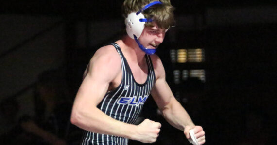 RYAN SPARKS | THE DAILY WORLD Elma’s Rusty Johnson celebrates after winning the 157-pound championship at the 1A District 4 EvCo tournament on Saturday at Hoquiam High School.