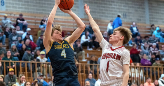 PHOTO BY FOREST WORGUM Aberdeen’s Tarren Lewis (4) shoots against Hoquiam’s Ryker Maxfield during the Grizzlies’ 53-44 victory on Saturday at Hoquiam Square Garden.