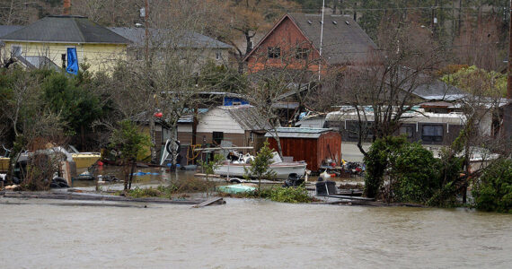 The Daily World file photo
Looking west from the bridge near Kurt Cobain Park, several homes appeared to have serious flooding from the Wishkah River at high tide in a round of flooding in 2018.